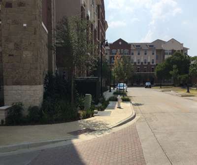 This is an image of sidewalks near buildings in Farmers Branch, Texas