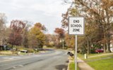 End of school zone sign around cross walk